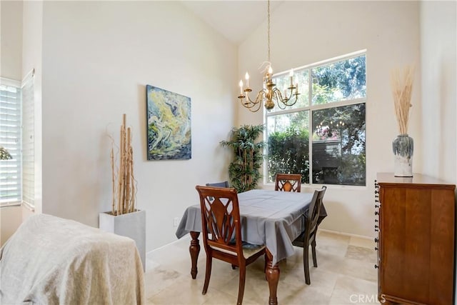 dining area featuring an inviting chandelier
