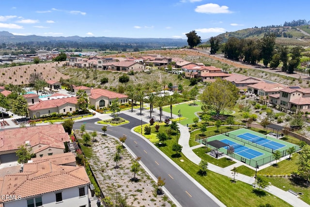 birds eye view of property with a mountain view and a residential view