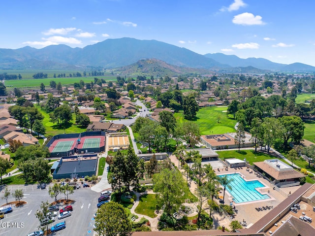birds eye view of property with a mountain view