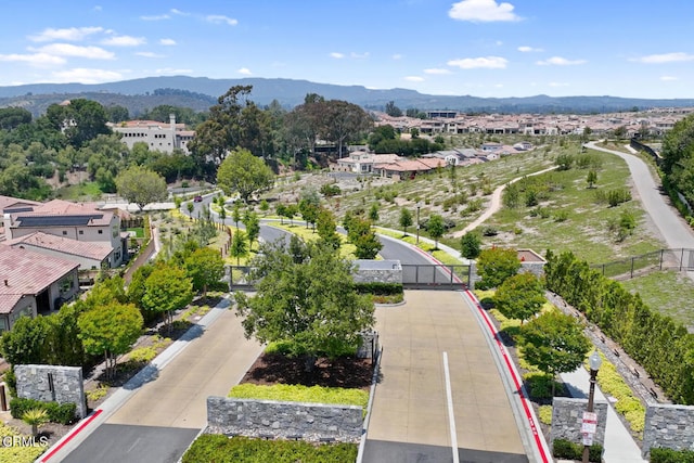 drone / aerial view featuring a residential view and a mountain view