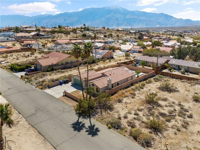 drone / aerial view with a residential view and a mountain view