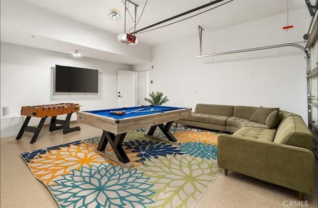 playroom featuring speckled floor, billiards, and a garage