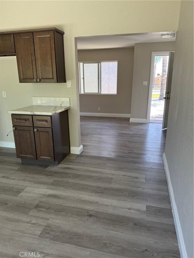 518 E 2nd St, Rialto, CA 92376 - kitchen featuring light countertops, wood finished floors, and open floor plan