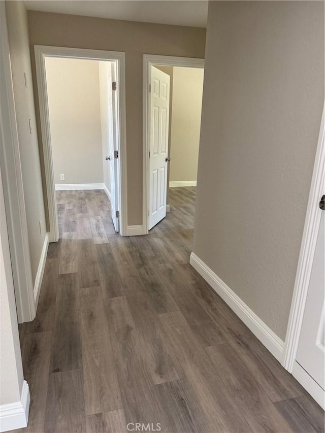 518 E 2nd St, Rialto, CA 92376 - hall with dark wood-type flooring and baseboards