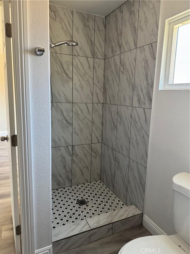 518 E 2nd St, Rialto, CA 92376 - bathroom featuring toilet and a stall shower