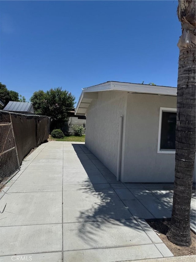 518 E 2nd St, Rialto, CA 92376 - view of property exterior with stucco siding and a patio