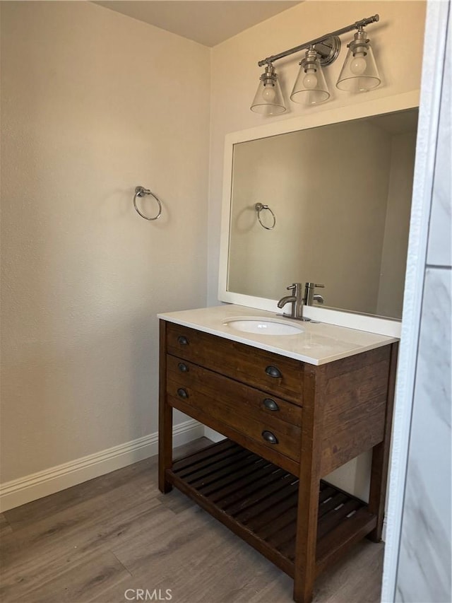 518 E 2nd St, Rialto, CA 92376 - bathroom featuring wood finished floors and vanity