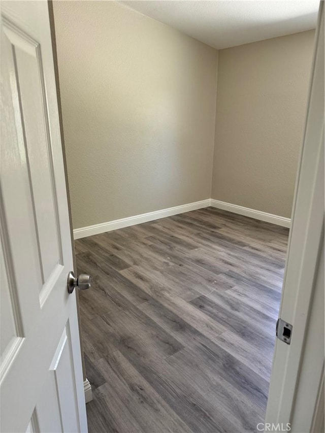 518 E 2nd St, Rialto, CA 92376 - unfurnished room featuring dark wood-type flooring and baseboards
