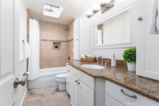 full bath with a skylight, vanity, toilet, and shower / tub combo