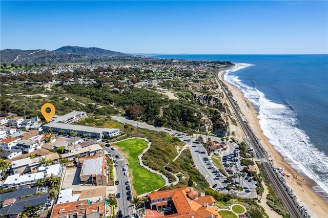 bird's eye view with a water and mountain view and a view of the beach