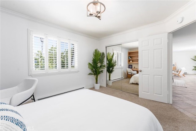 carpeted bedroom with crown molding, baseboards, a baseboard heating unit, and a closet