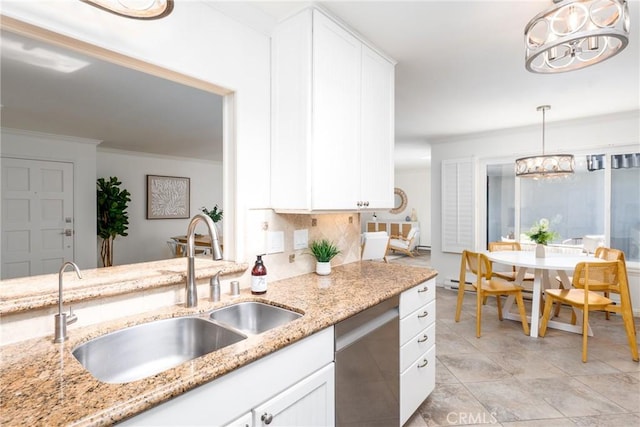kitchen featuring an inviting chandelier, a sink, white cabinetry, and dishwasher