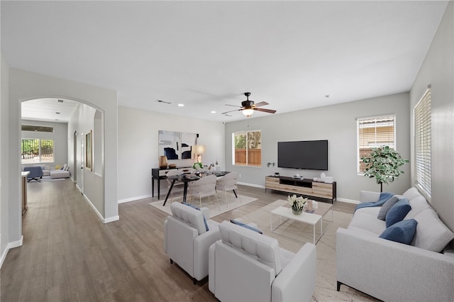 24898 Sunset Vista Ave, Menifee, CA 92584 - living area featuring arched walkways, baseboards, ceiling fan, wood finished floors, and recessed lighting