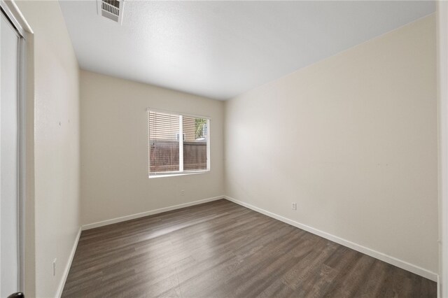 24898 Sunset Vista Ave, Menifee, CA 92584 - unfurnished room featuring dark wood-style flooring and baseboards