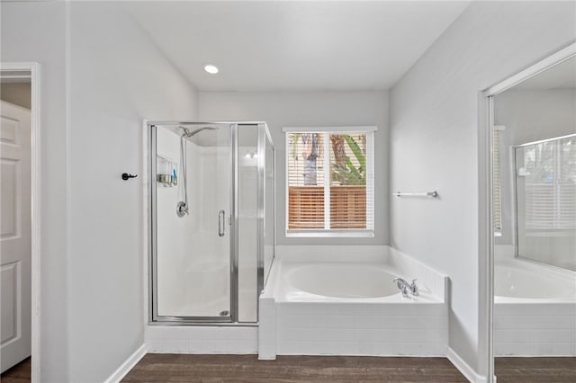 24898 Sunset Vista Ave, Menifee, CA 92584 - full bath featuring wood finished floors, a stall shower, a bath, and baseboards