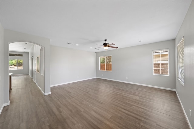 24898 Sunset Vista Ave, Menifee, CA 92584 - unfurnished room with arched walkways, ceiling fan, dark wood-type flooring, baseboards, and recessed lighting