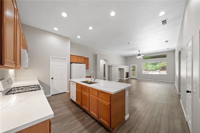 24898 Sunset Vista Ave, Menifee, CA 92584 - kitchen featuring a sink, white appliances, dark wood-style floors, ceiling fan, and brown cabinets