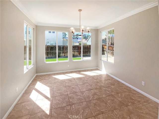 unfurnished dining area featuring crown molding, baseboards, and a chandelier