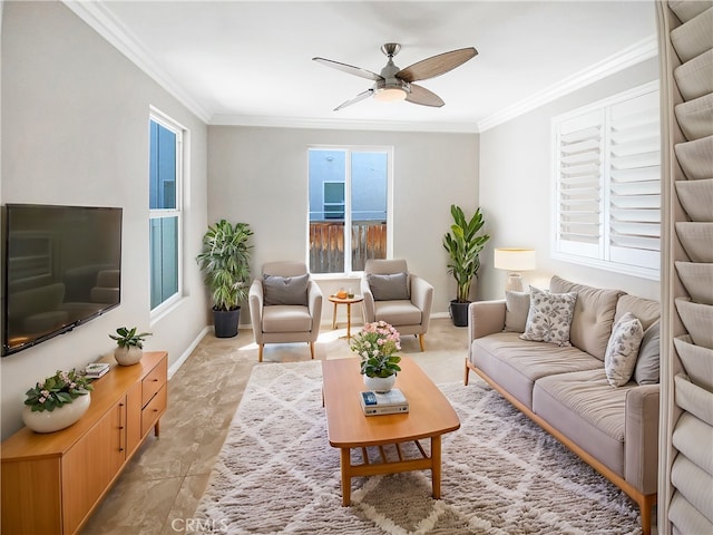 living room with baseboards, crown molding, and ceiling fan