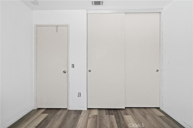 595 Casey Ct, Colton, CA 92324 - unfurnished bedroom featuring wood finished floors and a closet