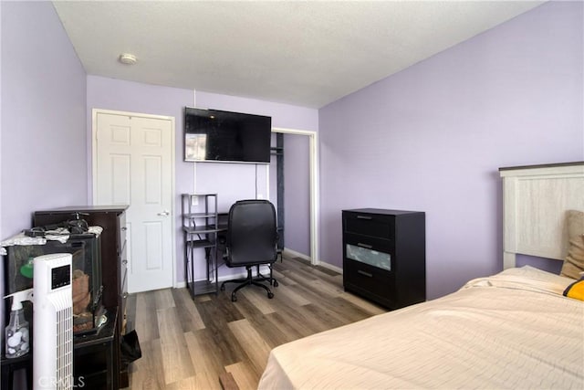 595 Casey Ct, Colton, CA 92324 - bedroom with wood finished floors, a desk, and baseboards