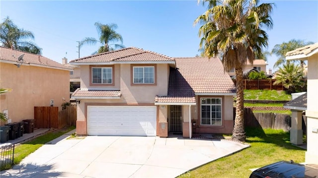 595 Casey Ct, Colton, CA 92324 - view of front of house with stucco siding, a tiled roof, driveway, and an attached garage
