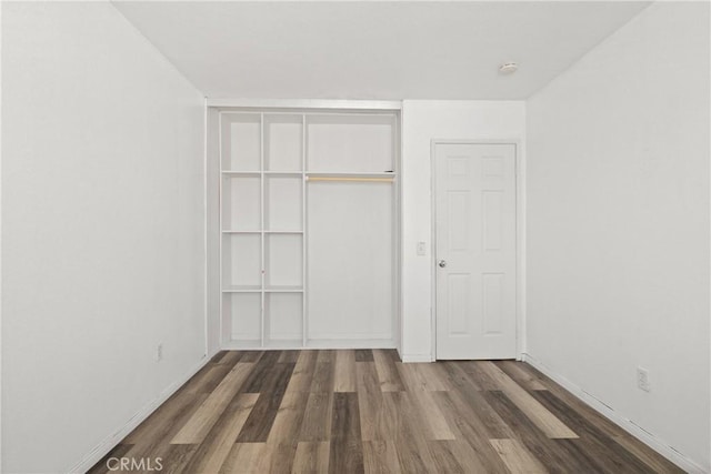 595 Casey Ct, Colton, CA 92324 - unfurnished bedroom featuring wood finished floors, a closet, and baseboards