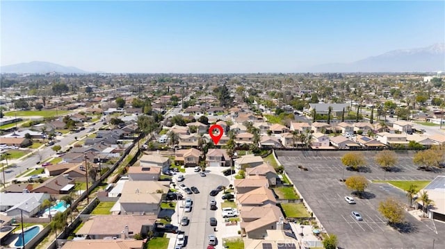 595 Casey Ct, Colton, CA 92324 - aerial view of property's location with mountains and nearby suburban area