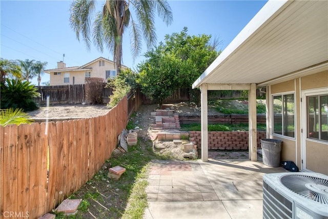 595 Casey Ct, Colton, CA 92324 - fenced backyard with central air condition unit and a patio area