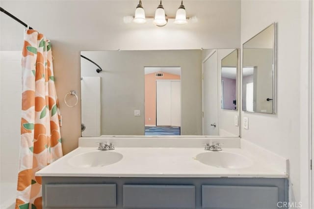 595 Casey Ct, Colton, CA 92324 - full bath with double vanity and shower / bathtub combination with curtain