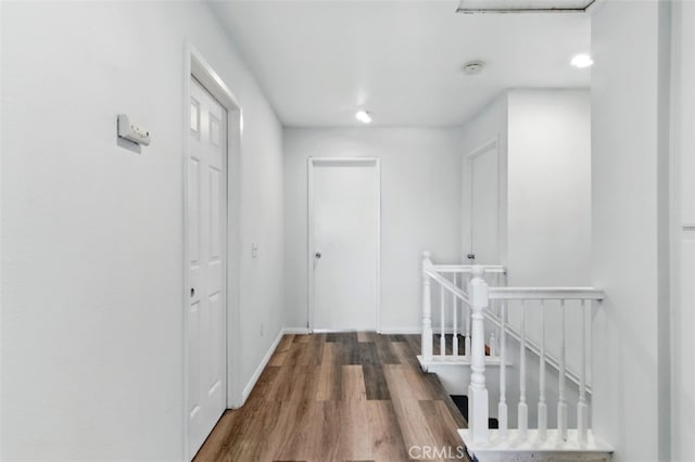 595 Casey Ct, Colton, CA 92324 - hallway featuring an upstairs landing, wood finished floors, and baseboards