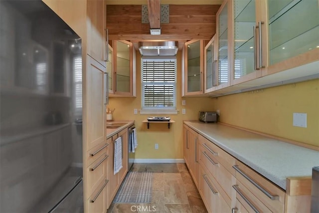 1631 Salem St, Chico, CA 95928 - kitchen featuring freestanding refrigerator, glass insert cabinets, light countertops, and light brown cabinets
