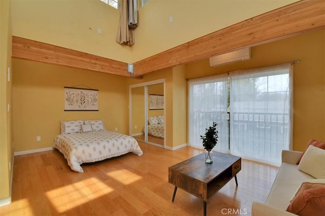 1631 Salem St, Chico, CA 95928 - bedroom featuring wood finished floors, access to exterior, and a wall mounted AC