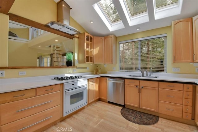 1631 Salem St, Chico, CA 95928 - kitchen with oven, dishwasher, gas stovetop, light brown cabinetry, and light wood-style flooring