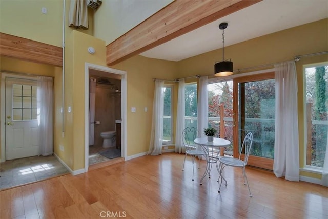 1631 Salem St, Chico, CA 95928 - unfurnished dining area with light wood finished floors and beamed ceiling
