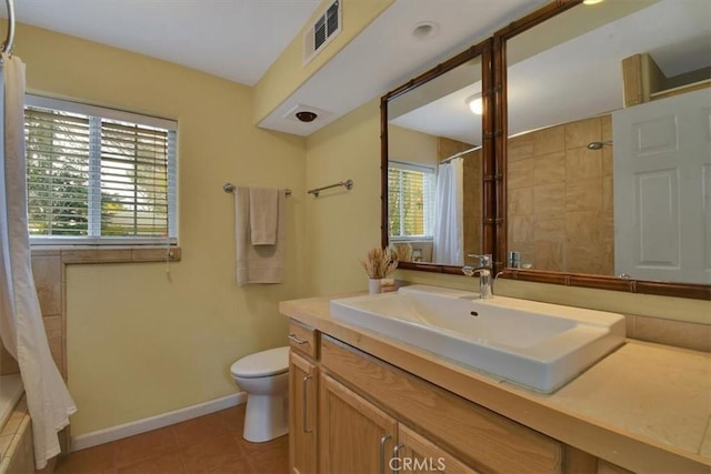 1631 Salem St, Chico, CA 95928 - bathroom featuring vanity, tile patterned floors, and tiled shower / bath combo