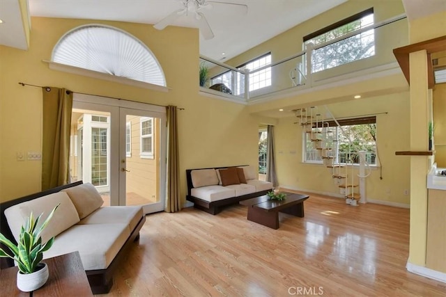 1631 Salem St, Chico, CA 95928 - living room featuring french doors, wood finished floors, a ceiling fan, a high ceiling, and recessed lighting