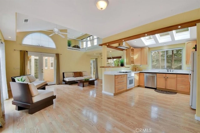 1631 Salem St, Chico, CA 95928 - kitchen with white appliances, light brown cabinets, light wood-style flooring, open floor plan, and french doors