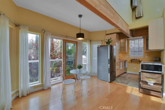1631 Salem St, Chico, CA 95928 - dining room featuring light wood finished floors and beamed ceiling