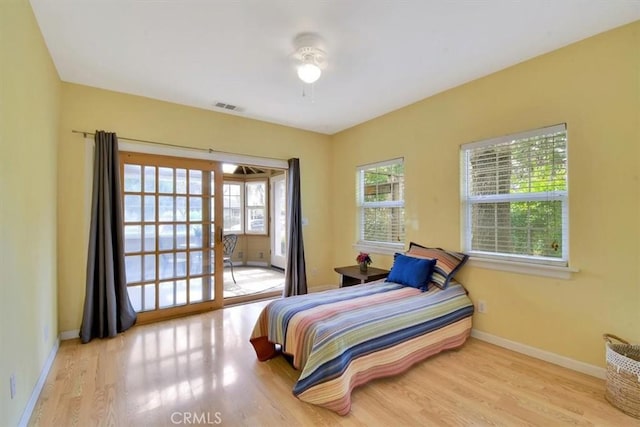 1631 Salem St, Chico, CA 95928 - bedroom featuring wood finished floors, access to exterior, and ceiling fan