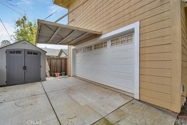 1631 Salem St, Chico, CA 95928 - garage featuring a storage shed and concrete driveway