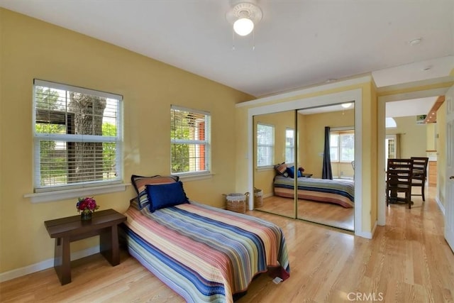 1631 Salem St, Chico, CA 95928 - bedroom with wood finished floors, multiple windows, and a closet