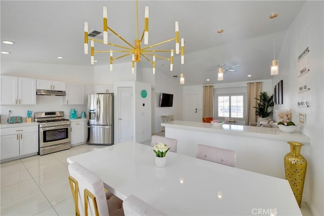 82235 Calico Ave, Indio, CA 92201 - dining space featuring high vaulted ceiling, a chandelier, recessed lighting, and light tile patterned floors
