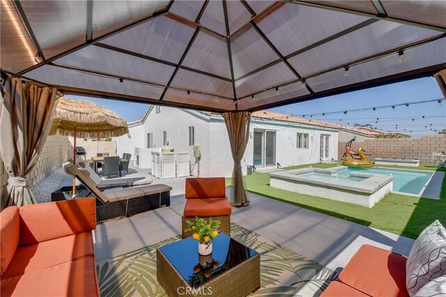 view of patio / terrace featuring outdoor lounge area, a gazebo, outdoor dining area, and a fenced in pool