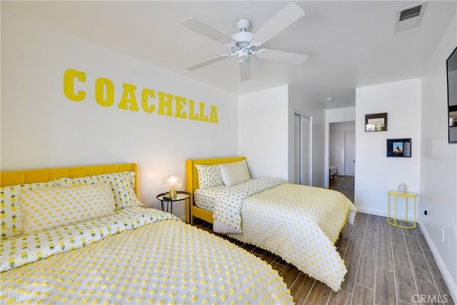 82235 Calico Ave, Indio, CA 92201 - bedroom featuring wood tiled floors, baseboards, a closet, and a ceiling fan