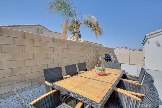 82235 Calico Ave, Indio, CA 92201 - fenced backyard with outdoor dining space and grilling area