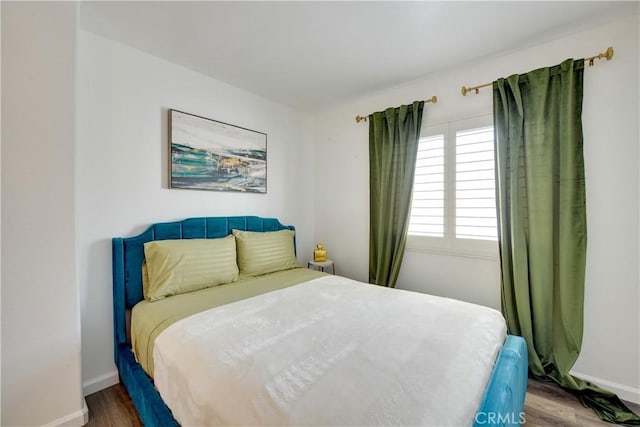82235 Calico Ave, Indio, CA 92201 - bedroom featuring baseboards and wood finished floors