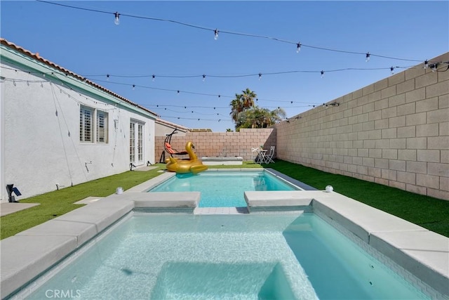 82235 Calico Ave, Indio, CA 92201 - view of swimming pool featuring french doors, a fenced backyard, and a pool with connected hot tub