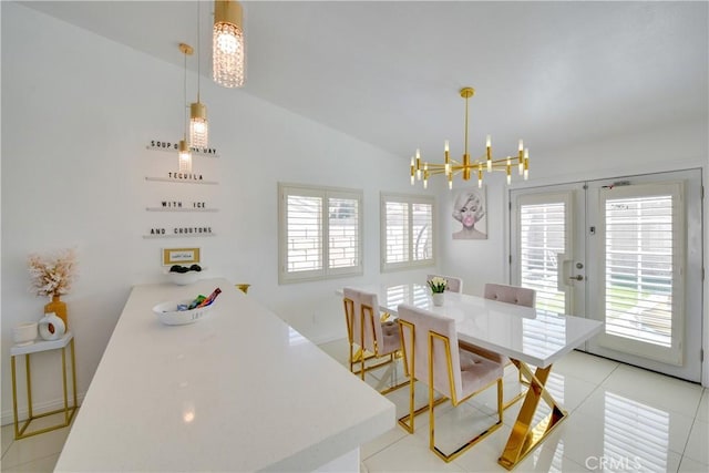 82235 Calico Ave, Indio, CA 92201 - dining space featuring a chandelier, french doors, lofted ceiling, and light tile patterned floors