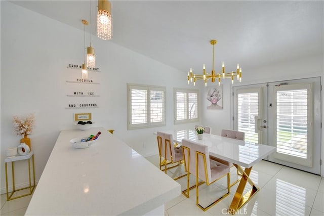 82235 Calico Ave, Indio, CA 92201 - dining space featuring a chandelier, french doors, lofted ceiling, and light tile patterned floors